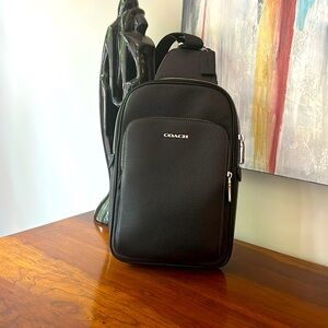 Coach black leather backpack.